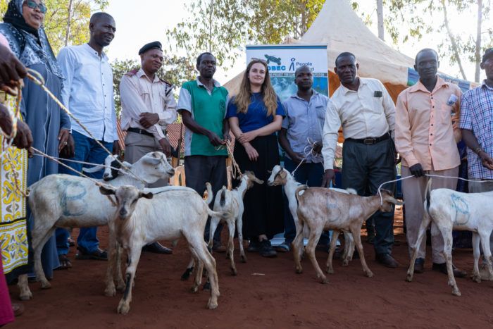 group of people being happy about the new goats